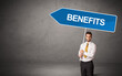 © ra2 studio - Young business person in casual holding road sign