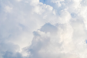 Wall Mural - cloudy sky background. sunlight shining through white clouds.