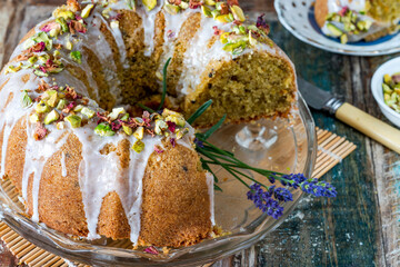 Sticker - Fragrant Persian love cake decorated with with vanilla icing, crushed pistachio nuts and dried rose petals