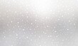 Glittering snow falling on light silver blur background. Bokeh winter holiday light gray textured banner.