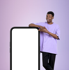 Poster - African man hand point at phone, mockup display on violet backgr