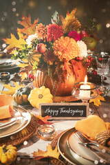 Wall Mural - Thanksgiving celebration traditional dinner table setting concept. Festive decorated Thanksgiving table with centerpiece from big pumpkin and bouquet of flowers and candles