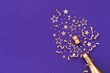 Golden champagne bottle with confetti stars and party decorations on violet background. Christmas, birthday or New Year greeting card.