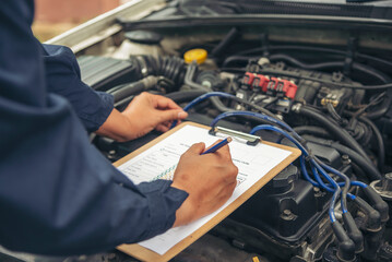 Wall Mural - Close up Man hands fixing Car machinery vehicle mechanical service. Mechanic man hands repairing car auto repair shop. open vehicle hood checking up auto mobile. Vehicle Car maintenance engineer.