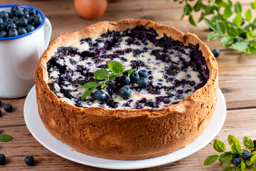 Wall Mural - Blueberry pie with cottage cheese on wooden table