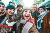 Fototapeta Fototapeta Londyn - Happy friends group wearing winter clothes taking selfie walking on city street - Cheerful young people hanging outside enjoying winter holidays - Friendship concept with guys and girls laughing loud