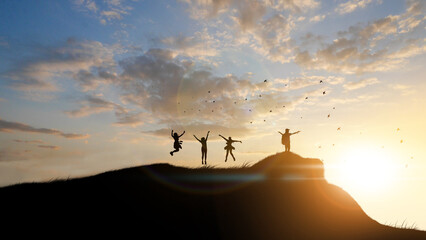 Happy cheering celebrating success woman at beautiful sunset above the clouds. Girl enjoying view of colorful sunset with arms raised up towards the sky.