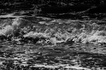 Aufkleber - sea waves with foam. black and white beach photography