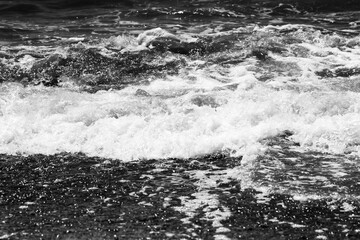Aufkleber - sea waves with foam. black and white beach photography