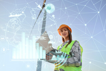 Wall Mural - Female engineer with laptop on windmill farm for electric power generation