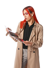 Wall Mural - Stylish transgender woman with fashion magazine on white background