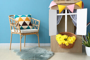 Sticker - Stylish interior of children's room with toy cardboard house near blue wall