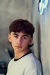 Vertical portrait of a young Caucasian boy with a fresh mullet haircut