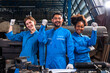 © anon - Engineer senior asian man and african woman wearing safety helmet working and checking machine  automotive part warehouse. Factory for the manufacture and processing.