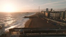 Beautiful Brighton Beach 4k Video. Magical Sunset And Stormy Weather In Brighton, UK. Town By The Ocean.