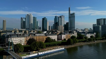 Canvas Print - Aerial view of a modern city at the river on a sunny day