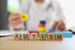 Word autism collected with wooden letters cubes