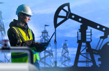 Poster - Employee of oil refinery. Man with laptop. Man controls oil production. Guy works for fuel corporation. Man in front of oil rigs. Engineer in yellow vest holds laptop. Hydrocarbon production
