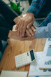 © ArLawKa - Businessmen join hands as a symbol of unity within the organization to strive for the success of teams and companies. collaboration concept