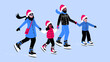 © Sophie Alp - happy mixed family ice skating during winter wearing Santa hats and outdoor winter clothes. family Christmas activity winter wonderland. winter sports together