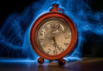 Red antique clock with Light painting effect.