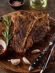 Wall Mural - Grilled BBQ T-Bone Steak. Close up of a succulent tender grilled porterhouse steak.