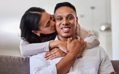 Canvas Print - Couple, kiss and cheek for hug, love and care relationship romance relaxing on the living room sofa at home. Portrait of happy man and woman with smile for romantic bonding time together at the house