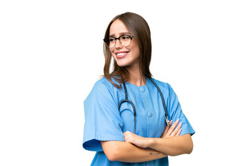 Young nurse caucasian woman over isolated background with arms crossed and happy