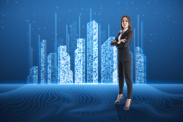 Canvas Print - Attractive young european businesswoman standing on blue background with abstract creative pixel city hologram. Smart city, innovated building architecture and engineering concept.