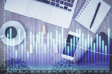 Poster - Double exposure of financial chart hologram over desktop with phone. Top view. Mobile trade platform concept.
