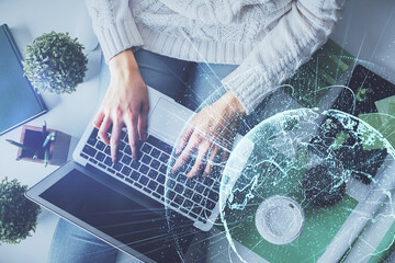 Aufkleber - Double exposure of woman hands working on computer and social network theme hologram drawing. Top View. People connection concept.
