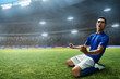 © fotokitas - Soccer player celebration in the stadium