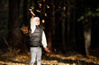 © Ruslan Ivantsov - Beautiful little girl wearing playing with dry leaves throwing them into the air