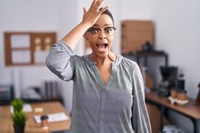 African American Woman Working At The Office Wearing Glasses Surprised With Hand On Head For Mistake, Remember Error. Forgot, Bad Memory Concept.