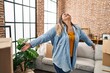 © Krakenimages.com - Young beautiful plus size woman smiling confident standing at new home