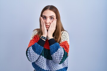 Poster - Young hispanic girl standing over blue background tired hands covering face, depression and sadness, upset and irritated for problem