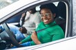 © Krakenimages.com - African american man and woman couple driving car at street