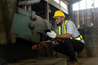 © SKW - African male chief engineer Working in the old factory to rehearse the engine
