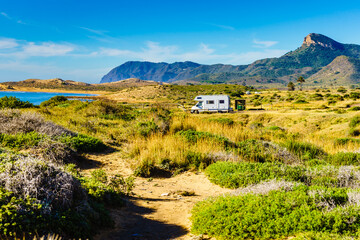 Wall Mural - Spanish coast with caravan camping in the distance