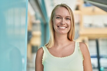 Canvas Print - Young blonde woman smiling confident standing at street