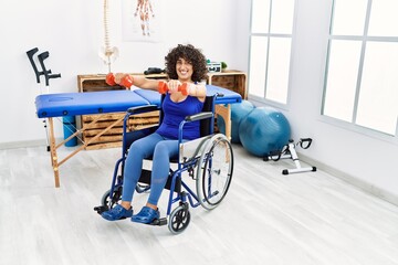 Wall Mural - Young middle east woman doing rehab sitting on wheelchair at clinic