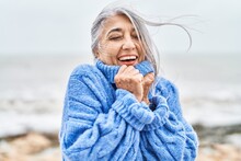 Middle Age Grey-haired Woman Smiling Confident Standing At Seaside