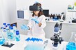 © Krakenimages.com - Young hispanic girl wearing virtual reality glasses at laboratory