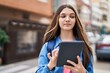 © Krakenimages.com - Adorable girl student using touchpad at street
