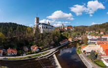 Czech Republic, South Bohemian Region, Rozmberk Nad Vltavou, Drone View Of Rozmberk Castle And Surrounding Town In Autumn
