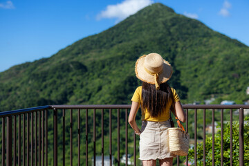 Sticker - Tourist woman look at the scenery view on mountain