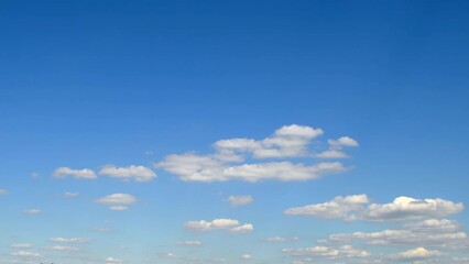 Wall Mural - Sky in calm weather. Still clouds changing shape in the blue sky.