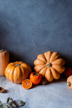 Raw Pumpkins And Assorted Autumn Veggies