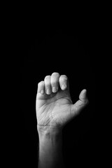 Wall Mural - Hand demonstrating the Japanese sign language letter 'E' or 'ぇ' with copy space