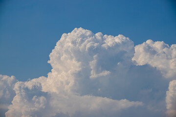 Wall Mural - white fluffy clouds in the blue sky background